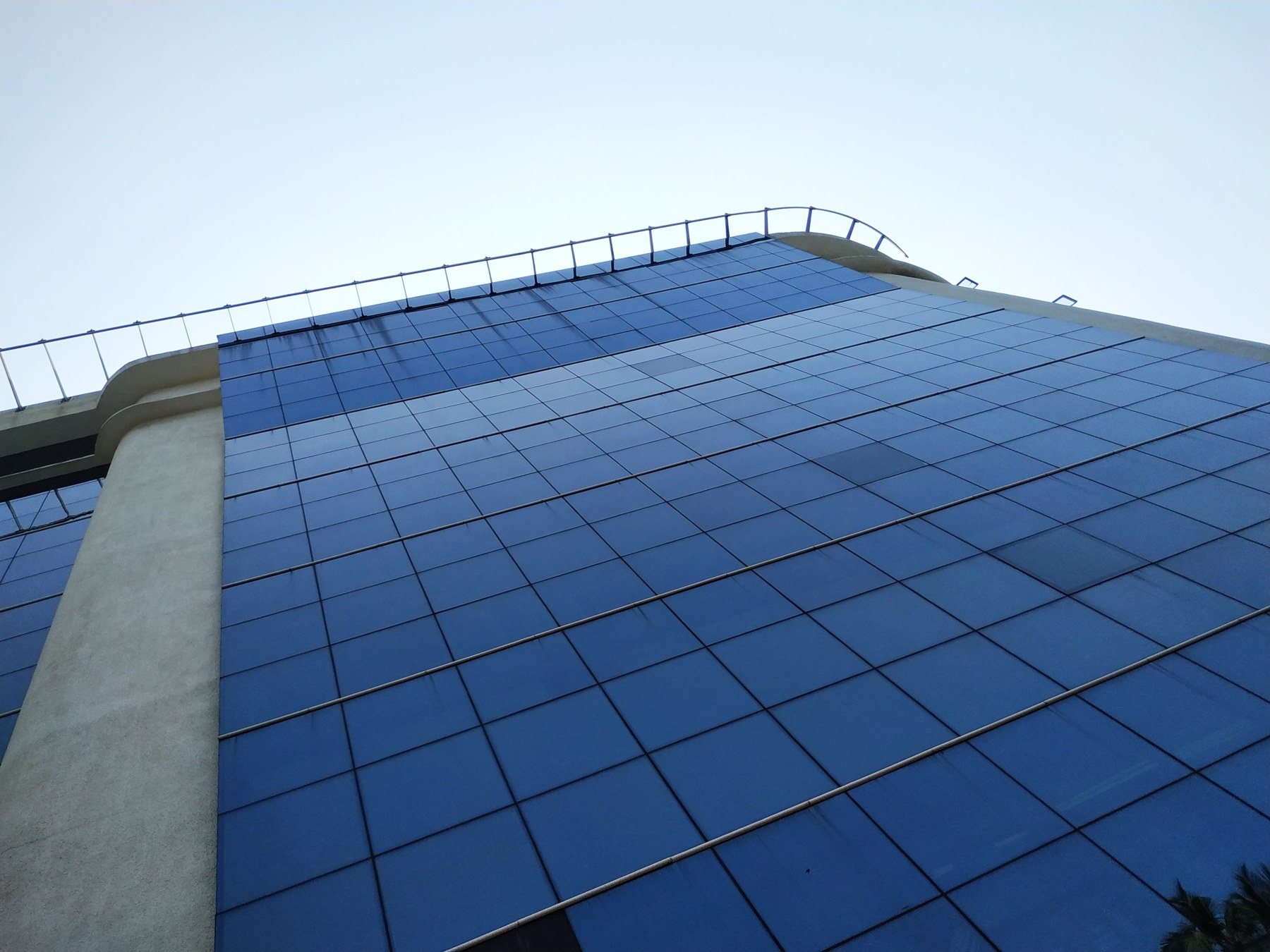 Reflective glass curtain wall with a visible aluminium grid